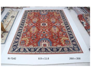 Handmade wool and cotton area rug or runner with classic floral Heriz pattern displayed on floor