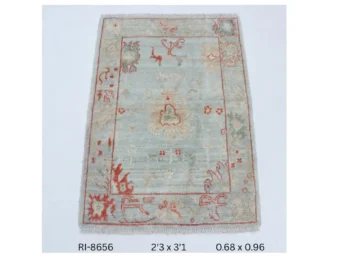 Handmade wool and cotton area rug or runner with classic floral Heriz pattern displayed on floor